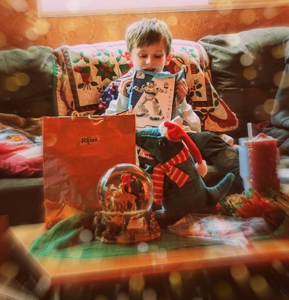 little boy playing with robot