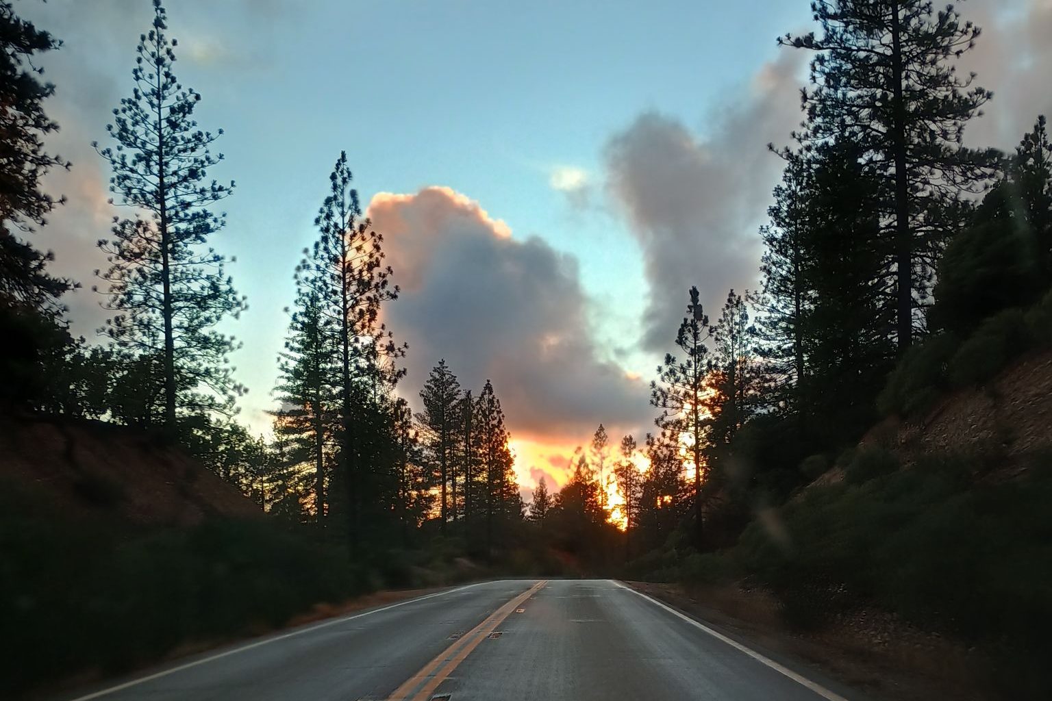 road with sunset in background
